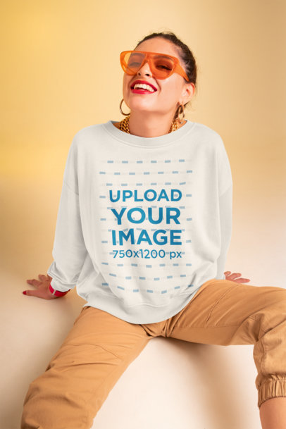 Sweatshirt Mockup Featuring a Woman with Trendy Sunglasses at a Studio