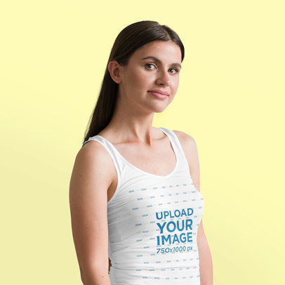 Mockup of a Straight-Haired Woman Posing with a Tank Top in a Studio