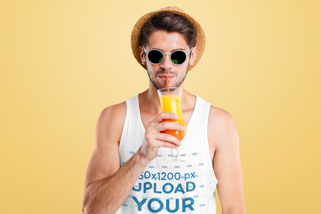 Tank Top Mockup of a Man Enjoying a Summer Cocktail in a Studio