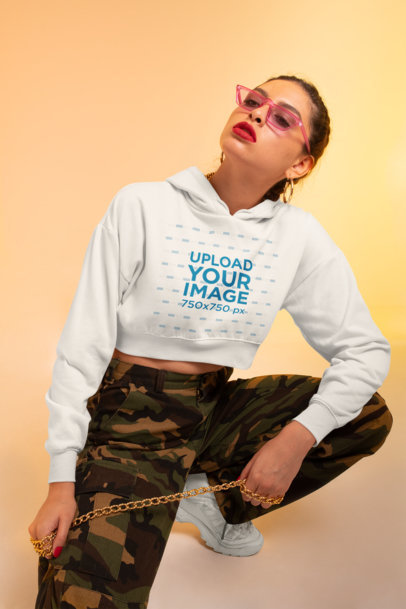 Crop Top Hoodie Mockup Featuring a Woman in a Streetwear Outfit