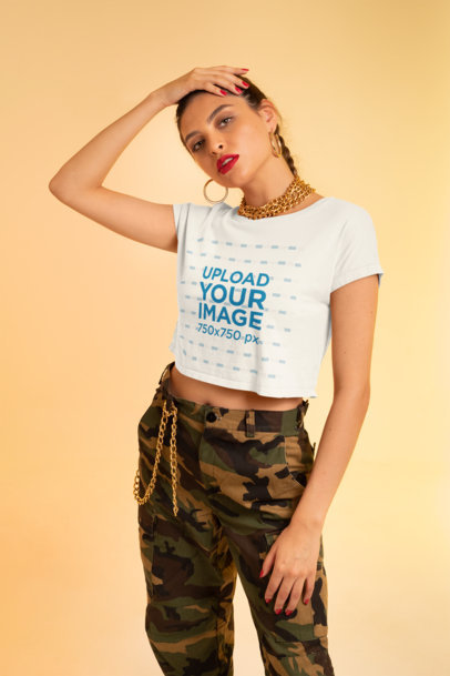 Mockup of a Fashionable Woman Posing with a Crop Top In a Studio