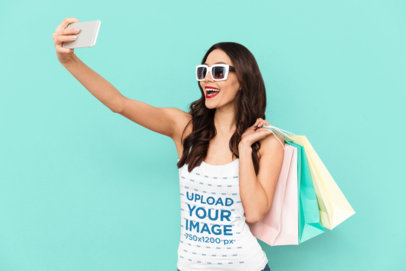 Tank Top Mockup of a Woman Taking a Selfie While Shopping