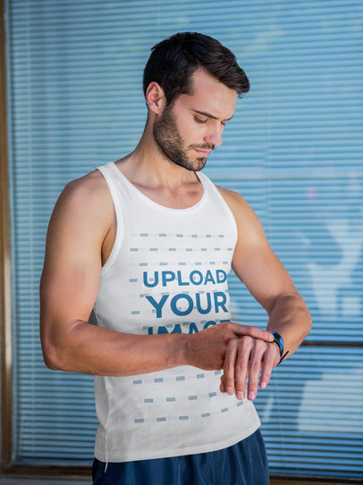 Tank Top Mockup of a Serious Bearded Man Checking His Watch 