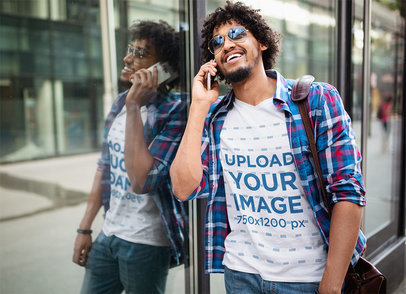V-Neck T-Shirt Mockup Featuring a Man With Sunglasses Making a Call