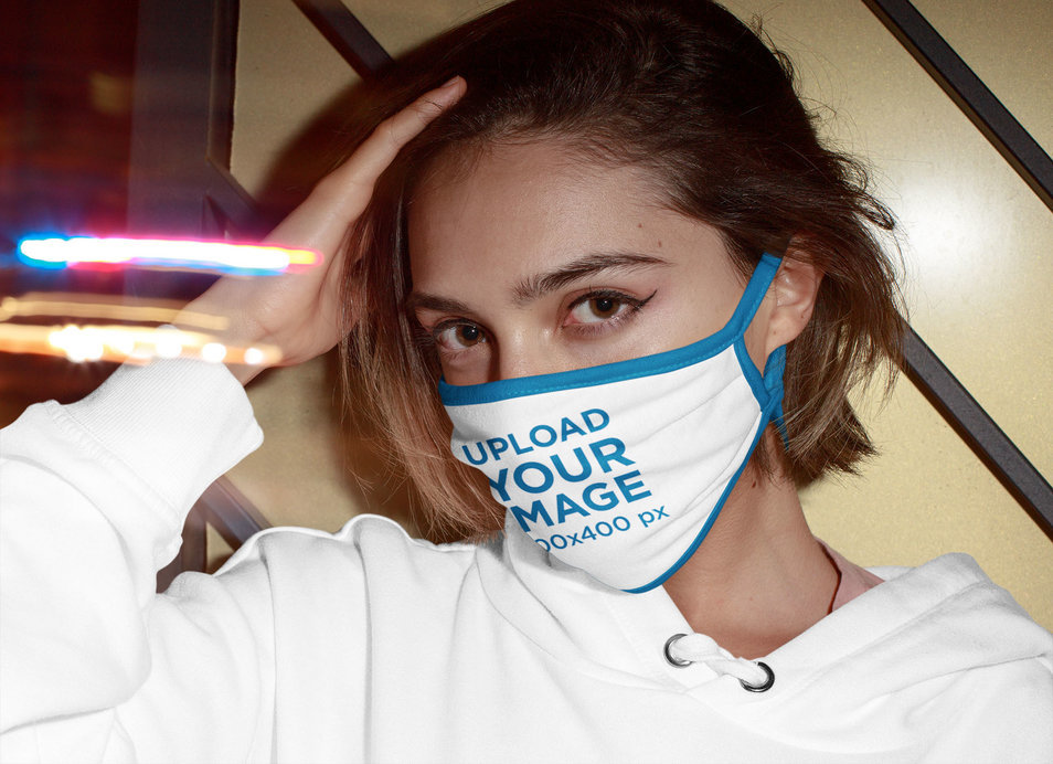 Mockup of a Woman Wearing a Face Mask at a Night Out