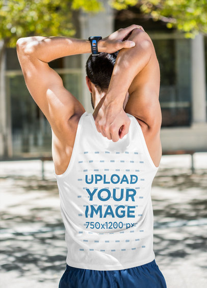 Tank Top Mockup of a Man Stretching His Arms Before a Jog
