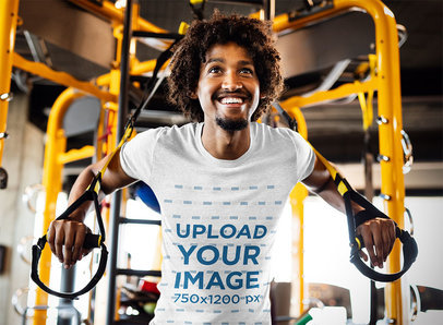 T-Shirt Mockup Featuring a Smiling Man Training at a Gym