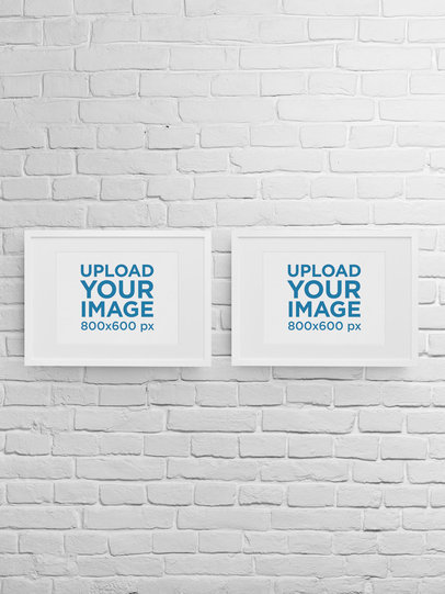 Mockup of Two Art Prints Placed on a Brick Wall