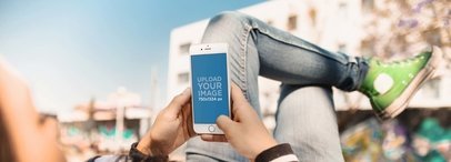 Mockup of a Girl Using her White iPhone 6 While Having a Break at the Skatepark a14703wide