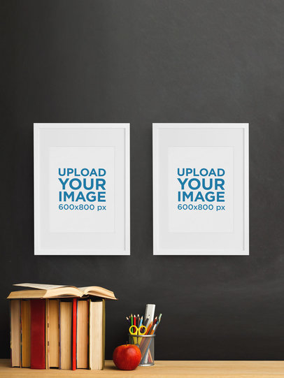 Mockup of Two Art Prints Placed Above a Desk