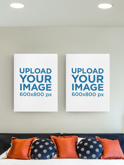 Mockup Featuring Two Framed Art Prints Hanging on a Bedroom's Wall