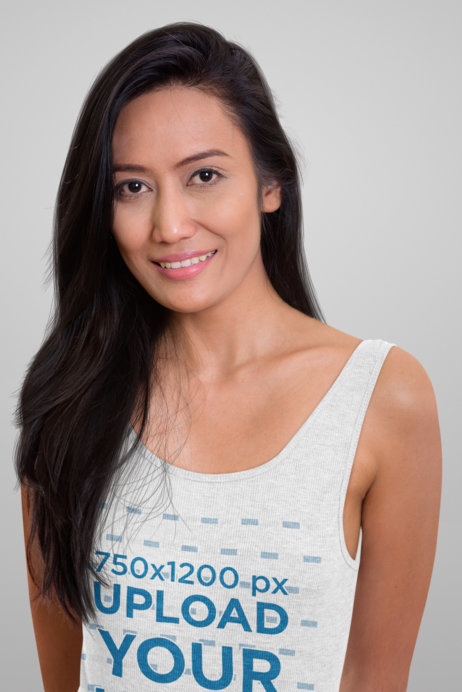 Mockup of a Brunette Woman Wearing a Heather Tank Top in a Studio