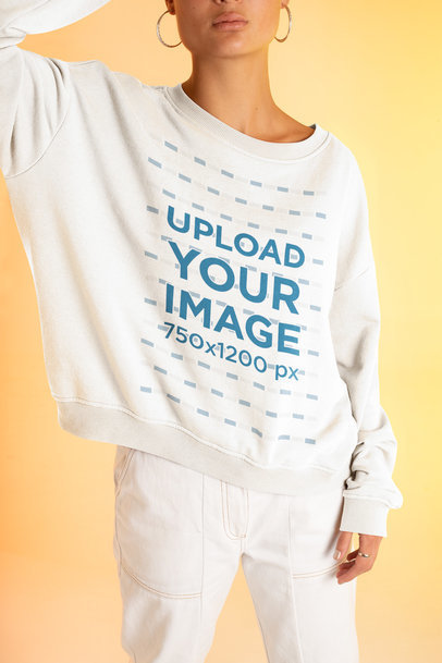 Sweatshirt Mockup of a Woman with an Androgynous Look Posing in a Studio