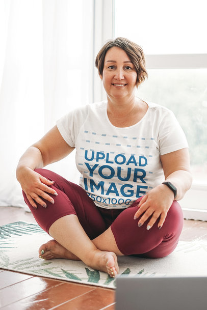 T-Shirt Mockup of a Middle-Aged Woman Doing Yoga at Home