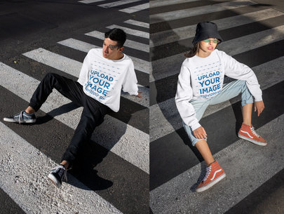 Sweatshirt Mockup of a Man and a Woman Sitting on a Crosswalk 