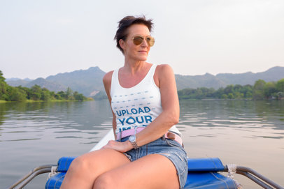 Mockup of a Woman with a Tank Top and Sunglasses at a Lake