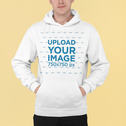 Pullover Hoodie Mockup Featuring a Man Standing at a Studio 