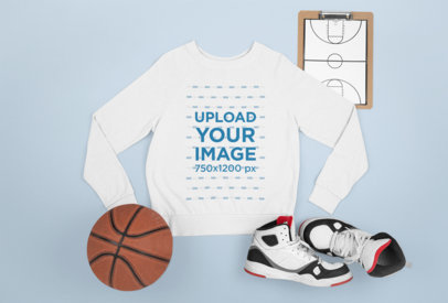 Flat Laid Sweatshirt Mockup Featuring a Basketball Ball 