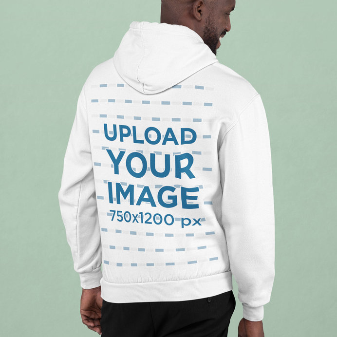 Back View Mockup of a Happy Man Wearing a Hoodie at a Studio