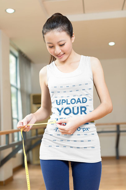 Tank Top Mockup of a Happy Woman Noticing Her Fitness Achievements