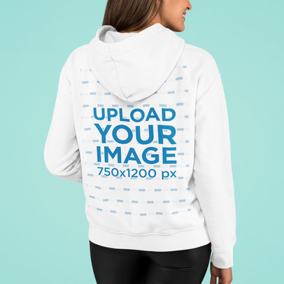 Mockup of a Woman Showing the Back of Her Hoodie in a Studio
