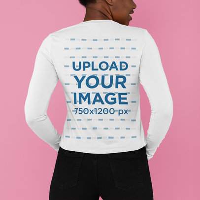 Back-View Mockup of a Woman Wearing a Long Sleeve Tee at a Studio 