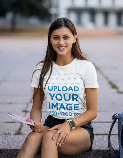 T-Shirt Mockup Featuring a Smiling College Student