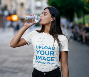 T-Shirt Mockup Featuring a Woman Drinking Water