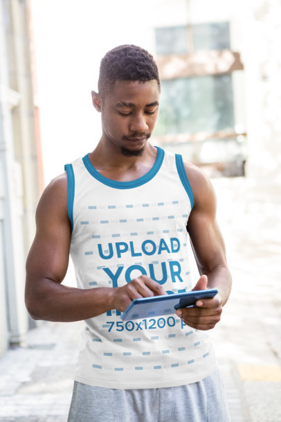 Ringer Tank Top Mockup of a Muscular Man Using a Tablet 40772-r-el2
