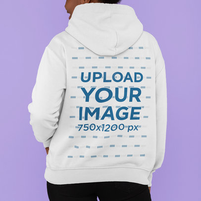 Back-View Hoodie Mockup Featuring a Young Woman in a Studio