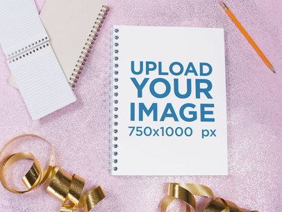 Template of a Spiral Notebook Lying on a Pink Surface Near Golden Ribbons and Smaller Notebooks a14831