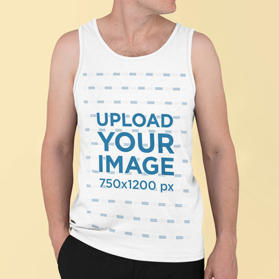 Tank Top Mockup Featuring a Man Standing in a Studio