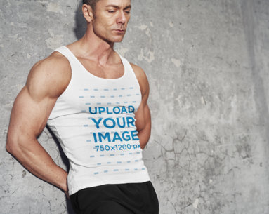 Tank Top Mockup Featuring a Muscular Man Leaning Against a Wall 35435-r-el2