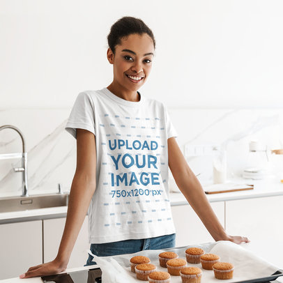 T-Shirt Mockup Featuring a Woman with a Tray of Cupcakes 