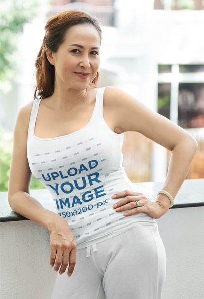 Tank Top Mockup of a Woman Posing in Her Balcony