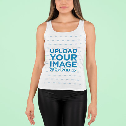 Tank Top Mockup of a Woman Posing Against a Solid Color Backdrop