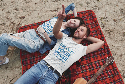 T-Shirt Mockup Featuring a Couple Watching the Clouds Go by 