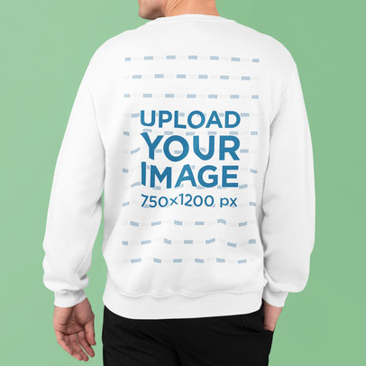Back View Mockup of a Man Wearing a Sweatshirt and Posing With a Hand in His Pocket 