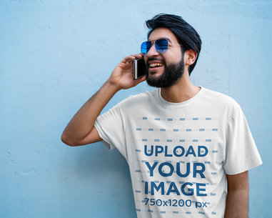 T-Shirt Mockup Featuring a Bearded Man on the Phone