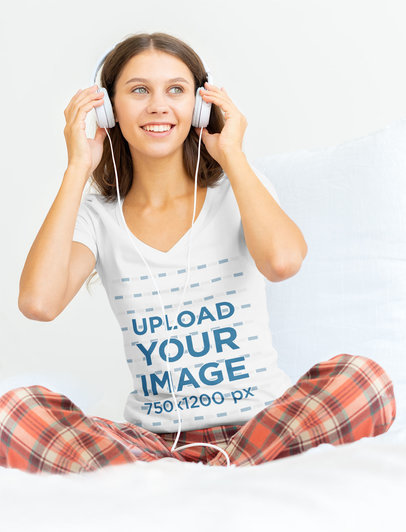 V-Neck Tee Mockup Featuring a Woman with Headphones on Her Bed 