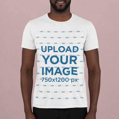 T-Shirt Mockup Featuring a Bearded Man Standing in a Studio