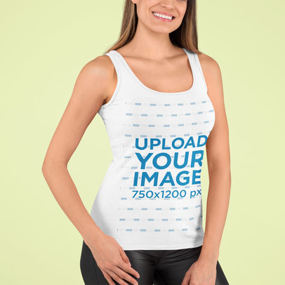 Tank Top Mockup of a Smiling Woman Standing in a Studio