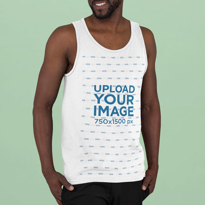 Mockup of a Young Man Wearing a Tank Top in a Studio