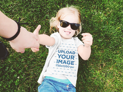 T-Shirt Mockup Featuring a Little Girl With Sunglasses 