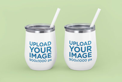 Mockup of Two Wine Tumblers Placed Against a Solid Color Backdrop