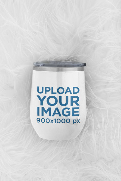 Mockup of a Wine Tumbler Placed on a Fluffy Surface