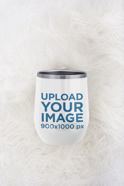 Mockup of a Wine Tumbler Placed on a Soft Surface