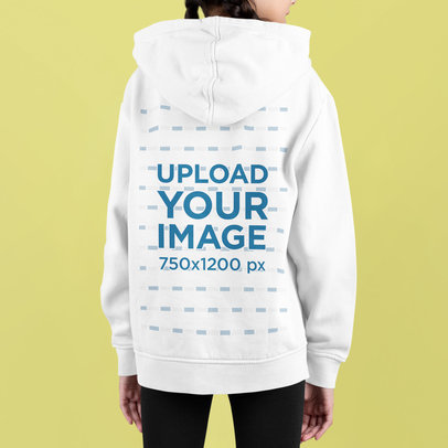 Back-View Hoodie Mockup of a Girl Standing in a Studio