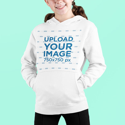 Front-View Mockup of a Smiling Girl Wearing a Pullover Hoodie at a Studio 