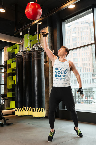 Sublimated Tank Top Mockup of an Athletic Man at the Gym